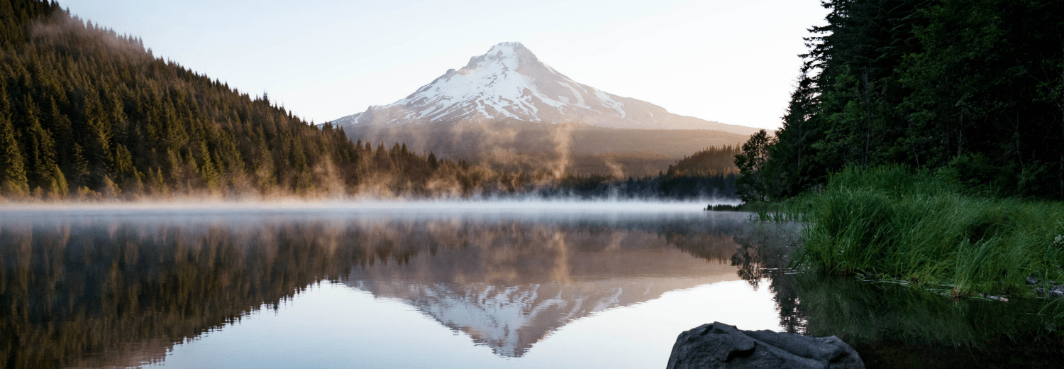 Misty lake in Oregon with mountain the background