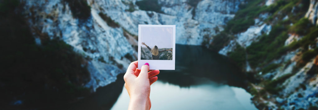 Person holding polaroid photo